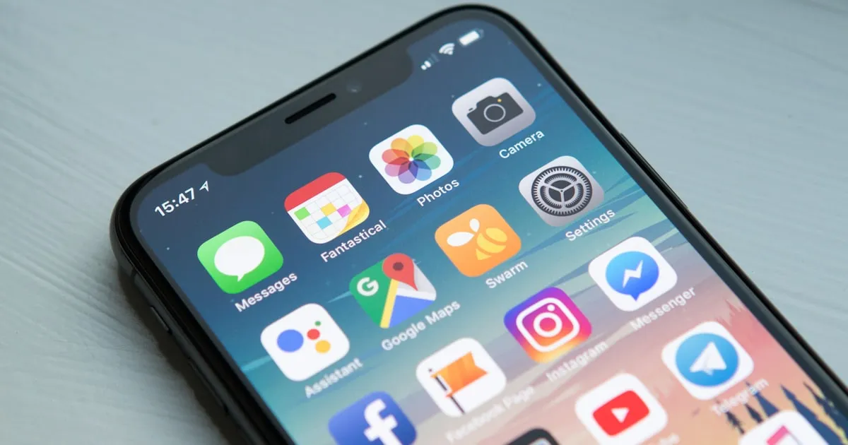 Person comparing patrol apps on a phone